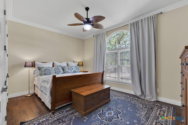 bedroom with crown molding, baseboards, ceiling fan, and dark wood finished floors
