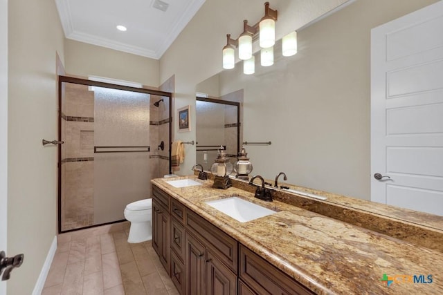 bathroom with a sink, crown molding, a shower stall, and double vanity
