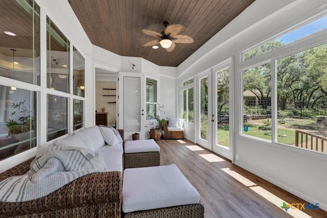 sunroom with a ceiling fan, wooden ceiling, french doors, and wood finished floors