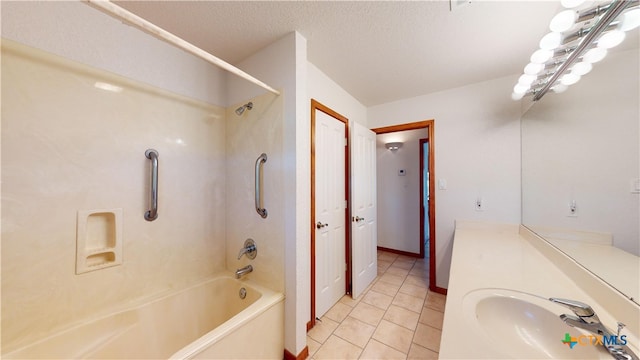 bathroom with vanity, tile patterned floors, a textured ceiling, and shower / bath combination