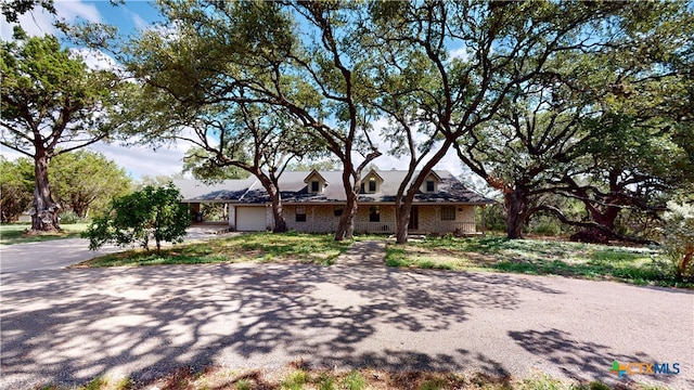 ranch-style home with a garage