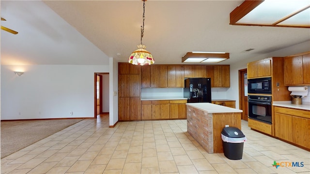 kitchen featuring pendant lighting, light colored carpet, a kitchen island, and black appliances