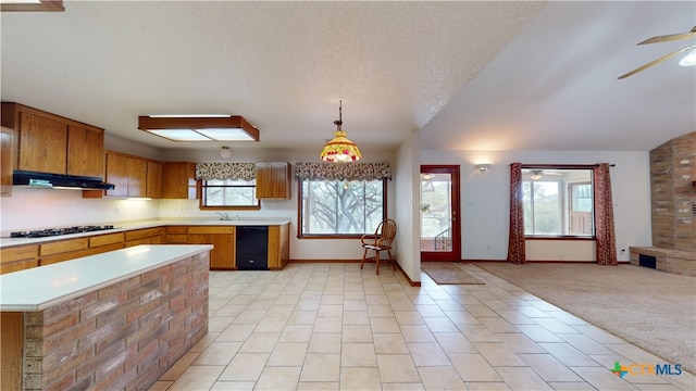 kitchen featuring pendant lighting, black dishwasher, ceiling fan, gas stovetop, and light carpet