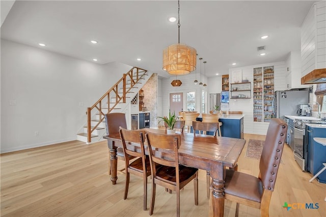 dining area with light wood-type flooring