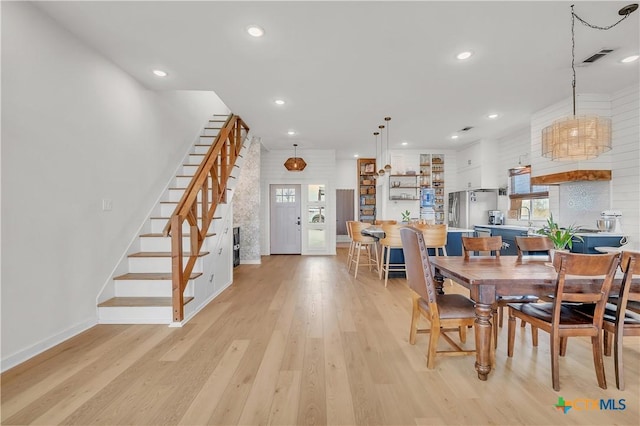 dining space featuring light hardwood / wood-style flooring