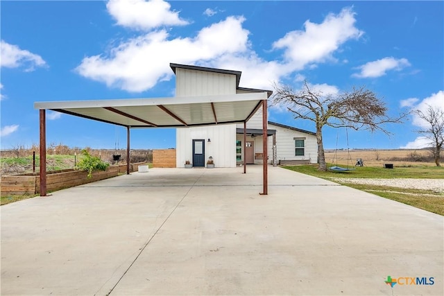 exterior space with a carport