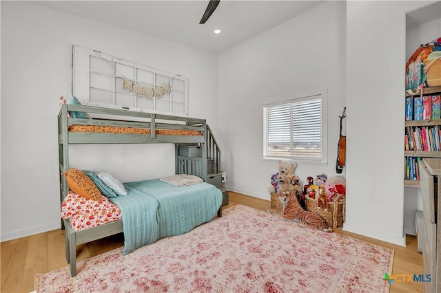 bedroom with ceiling fan and light hardwood / wood-style flooring