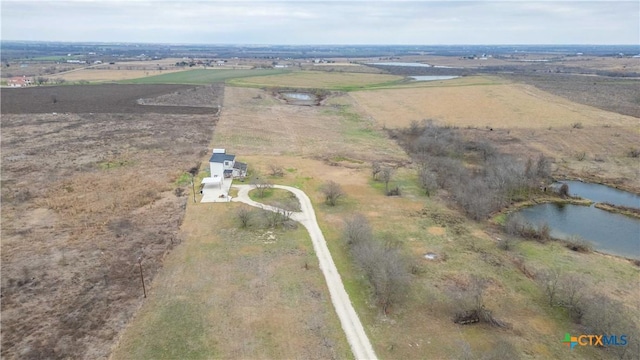 bird's eye view featuring a rural view and a water view