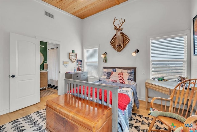 bedroom featuring wooden ceiling and light hardwood / wood-style floors