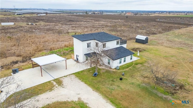 birds eye view of property featuring a rural view