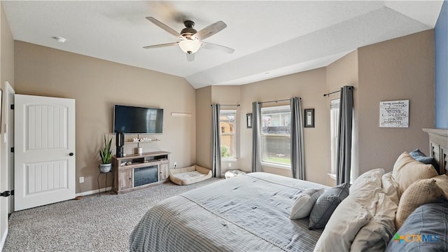 3616 Blue Cloud Dr, New Braunfels, TX 78130 - bedroom with carpet floors, a fireplace, baseboards, vaulted ceiling, and a ceiling fan