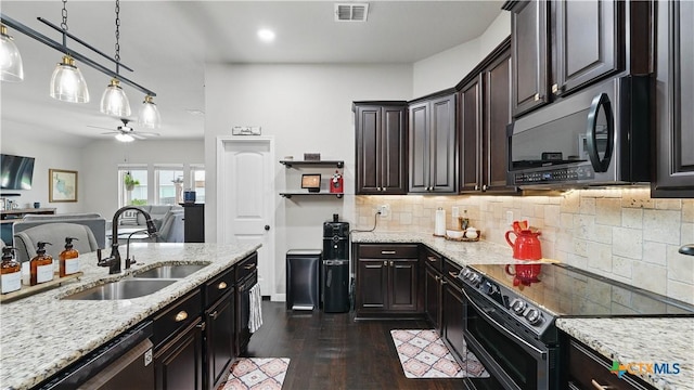 3616 Blue Cloud Dr, New Braunfels, TX 78130 - kitchen with double oven range, a sink, stainless steel dishwasher, a ceiling fan, and dark wood finished floors