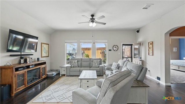 3616 Blue Cloud Dr, New Braunfels, TX 78130 - living room featuring arched walkways, ceiling fan, dark wood-type flooring, and baseboards