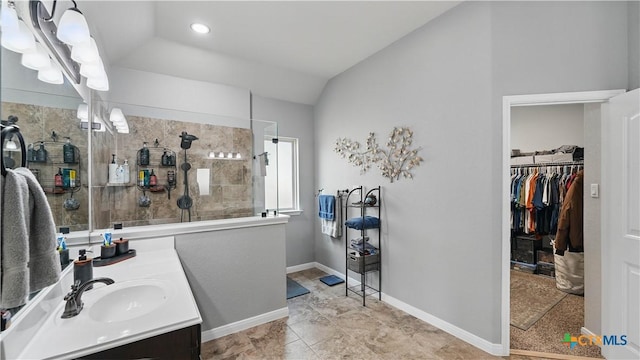 3616 Blue Cloud Dr, New Braunfels, TX 78130 - full bathroom featuring vanity, walk in shower, a walk in closet, lofted ceiling, and recessed lighting