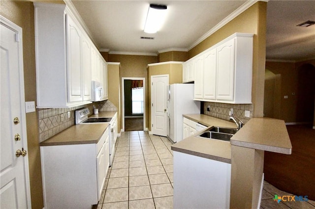 kitchen with white cabinetry, sink, backsplash, white appliances, and light tile patterned flooring