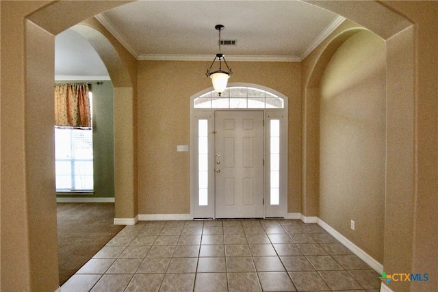 tiled entryway with ornamental molding