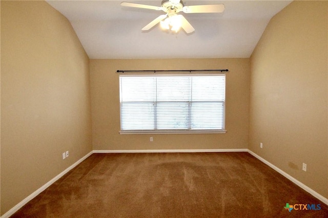 carpeted empty room featuring vaulted ceiling, a wealth of natural light, and ceiling fan