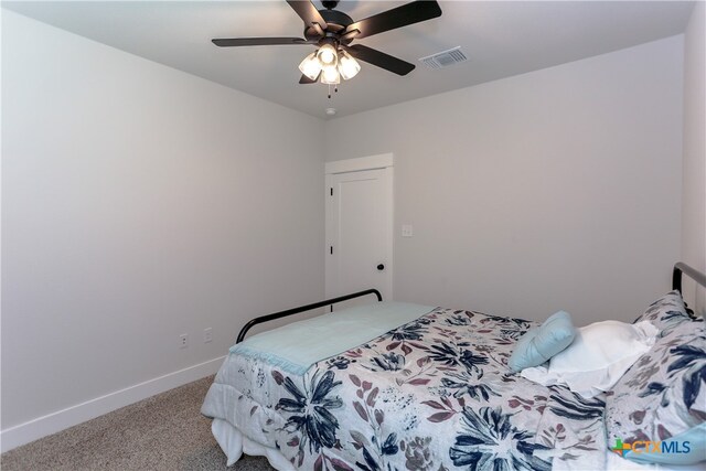 carpeted bedroom featuring ceiling fan