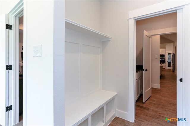 mudroom with wood-type flooring