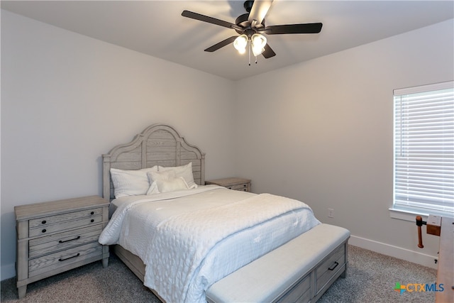 bedroom featuring light colored carpet and ceiling fan