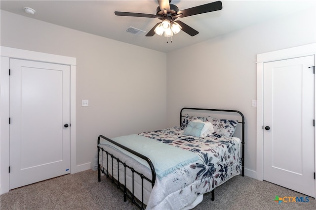 carpeted bedroom with ceiling fan