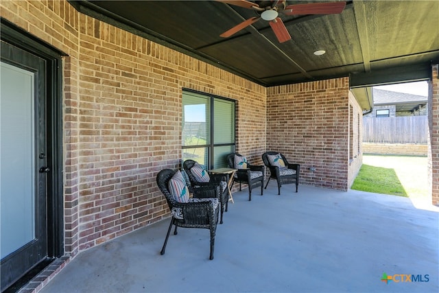 view of patio featuring ceiling fan