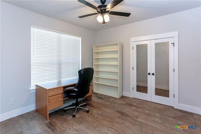 home office featuring dark hardwood / wood-style flooring, french doors, and ceiling fan