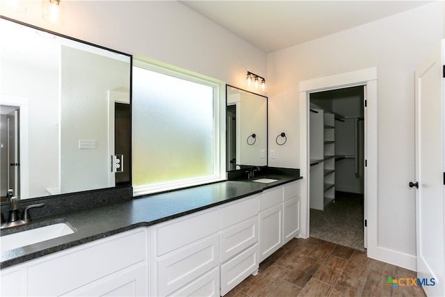 bathroom featuring wood-type flooring and vanity