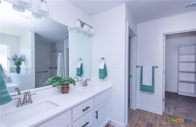 bathroom featuring vanity and curtained shower