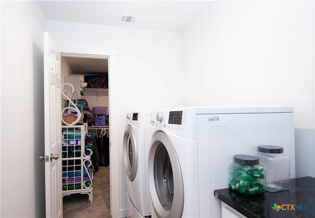 clothes washing area with carpet and independent washer and dryer