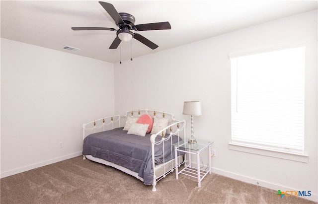 bedroom with ceiling fan and carpet