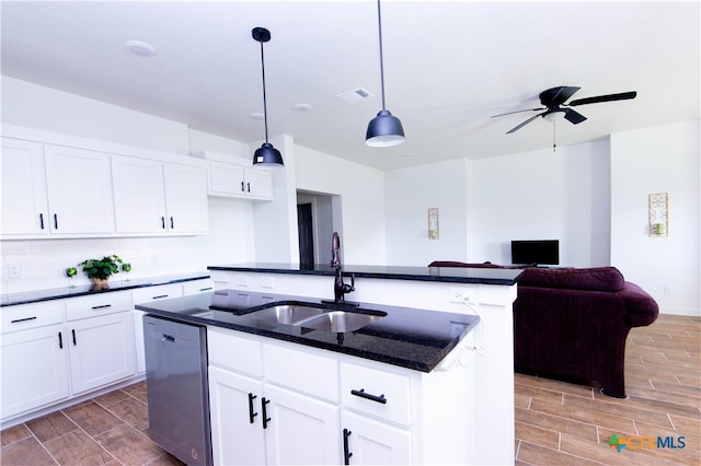 kitchen with sink, an island with sink, stainless steel dishwasher, dark hardwood / wood-style floors, and decorative light fixtures