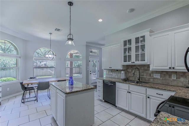11503 Meredith Dr, Belton, TX 76513 - kitchen with black appliances, a center island, white cabinetry, ornamental molding, and recessed lighting