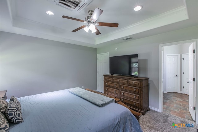 11503 Meredith Dr, Belton, TX 76513 - bedroom featuring a raised ceiling, stone tile flooring, ornamental molding, recessed lighting, and ceiling fan