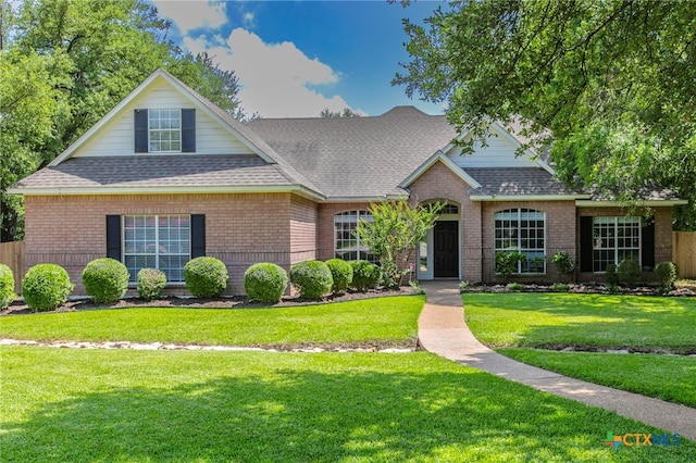 11503 Meredith Dr, Belton, TX 76513 - traditional-style home with brick siding, roof with shingles, and a front yard