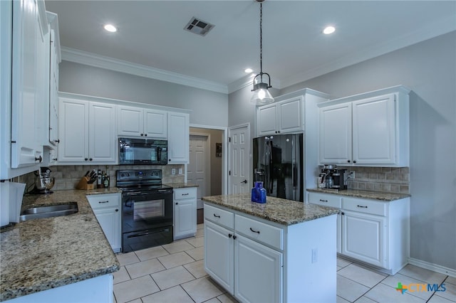 11503 Meredith Dr, Belton, TX 76513 - kitchen featuring black appliances, tasteful backsplash, white cabinetry, a kitchen island, and light tile patterned flooring