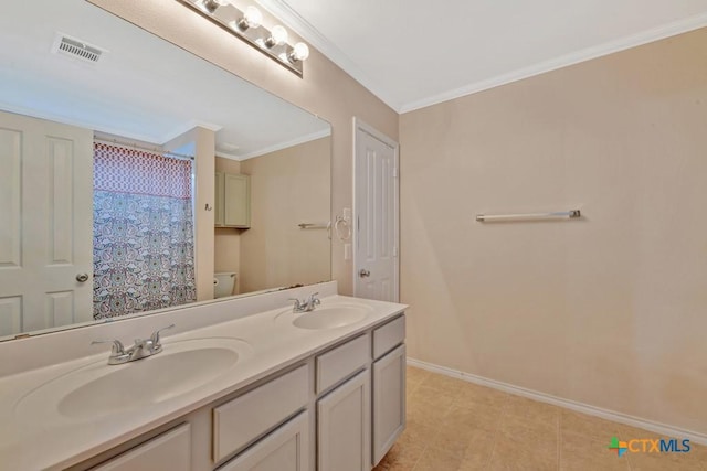 full bathroom with crown molding, double vanity, visible vents, and a sink