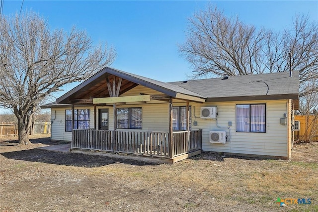 view of front facade with covered porch and ac unit