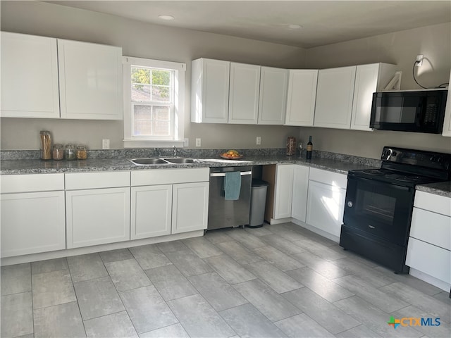 kitchen featuring white cabinetry, sink, and black appliances