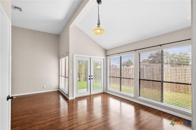 unfurnished room with french doors, visible vents, dark wood-type flooring, high vaulted ceiling, and baseboards