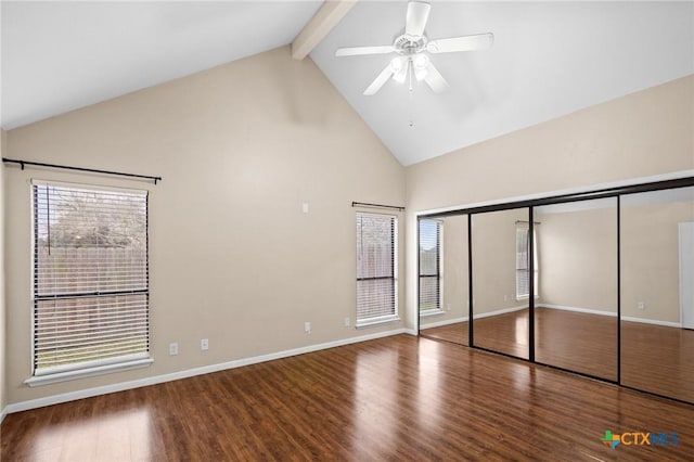 unfurnished bedroom with beam ceiling, ceiling fan, wood finished floors, high vaulted ceiling, and baseboards