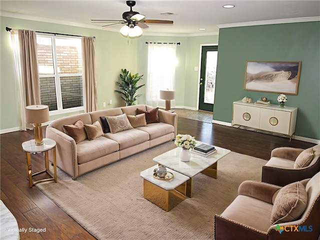 living room with a wealth of natural light, dark wood finished floors, and crown molding