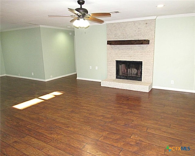 unfurnished living room featuring a fireplace, baseboards, dark wood finished floors, and crown molding