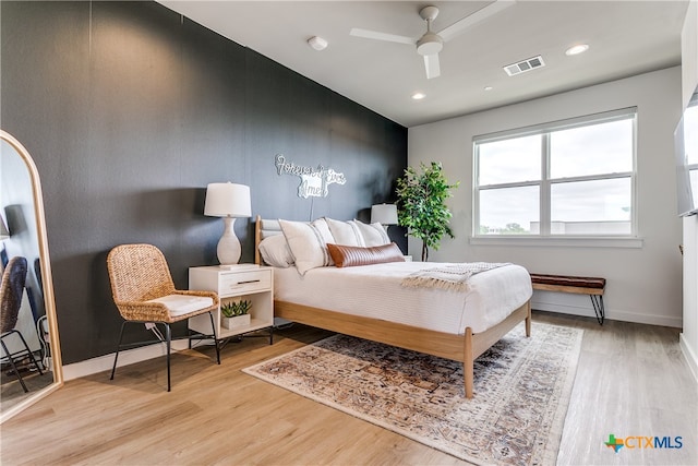 bedroom featuring light hardwood / wood-style flooring and ceiling fan