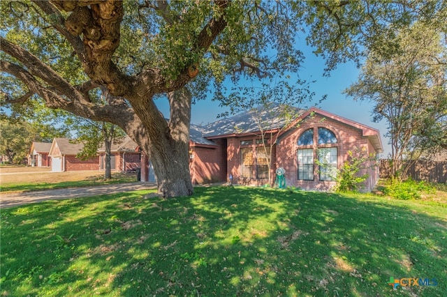 view of front of home with a front lawn