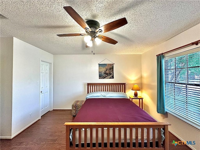 209 Westbrook Dr, Victoria, TX 77904 - bedroom featuring a textured ceiling, wood finished floors, and ceiling fan
