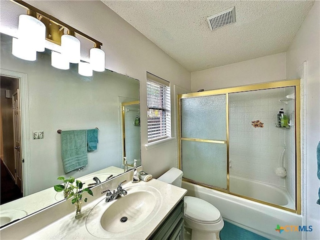 209 Westbrook Dr, Victoria, TX 77904 - bathroom with a textured ceiling, vanity, and enclosed tub / shower combo