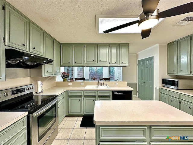 209 Westbrook Dr, Victoria, TX 77904 - kitchen with green cabinetry, appliances with stainless steel finishes, under cabinet range hood, a peninsula, and light countertops
