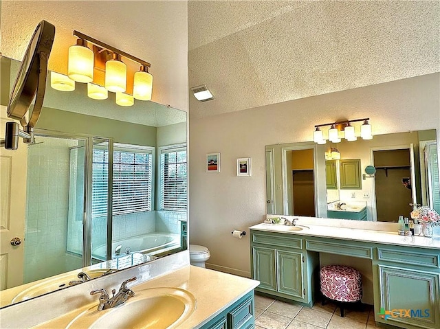 209 Westbrook Dr, Victoria, TX 77904 - full bathroom featuring a garden tub, tile patterned floors, vanity, vaulted ceiling, and a shower stall