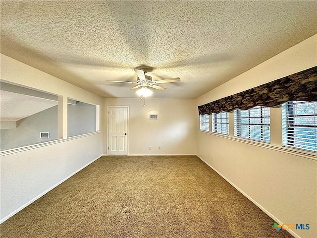 209 Westbrook Dr, Victoria, TX 77904 - carpeted empty room featuring a ceiling fan and a textured ceiling